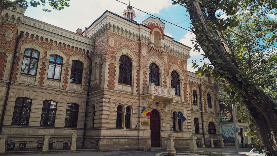 chisinau - a large building with a clock on the top of it