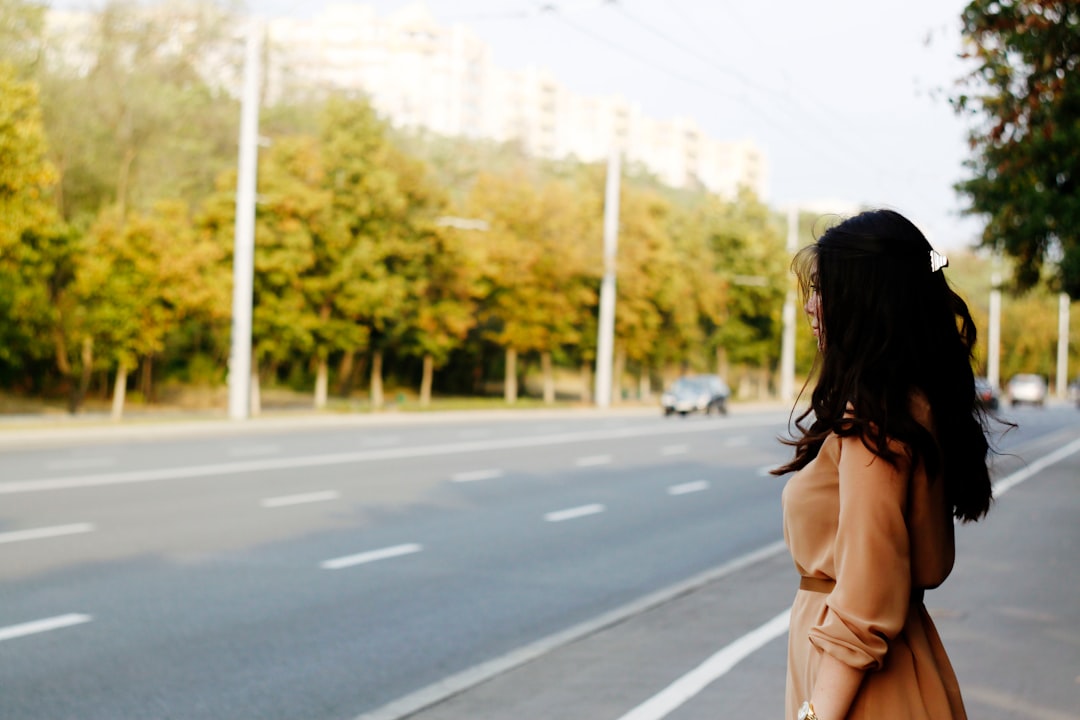 chisinau - woman standing beside road