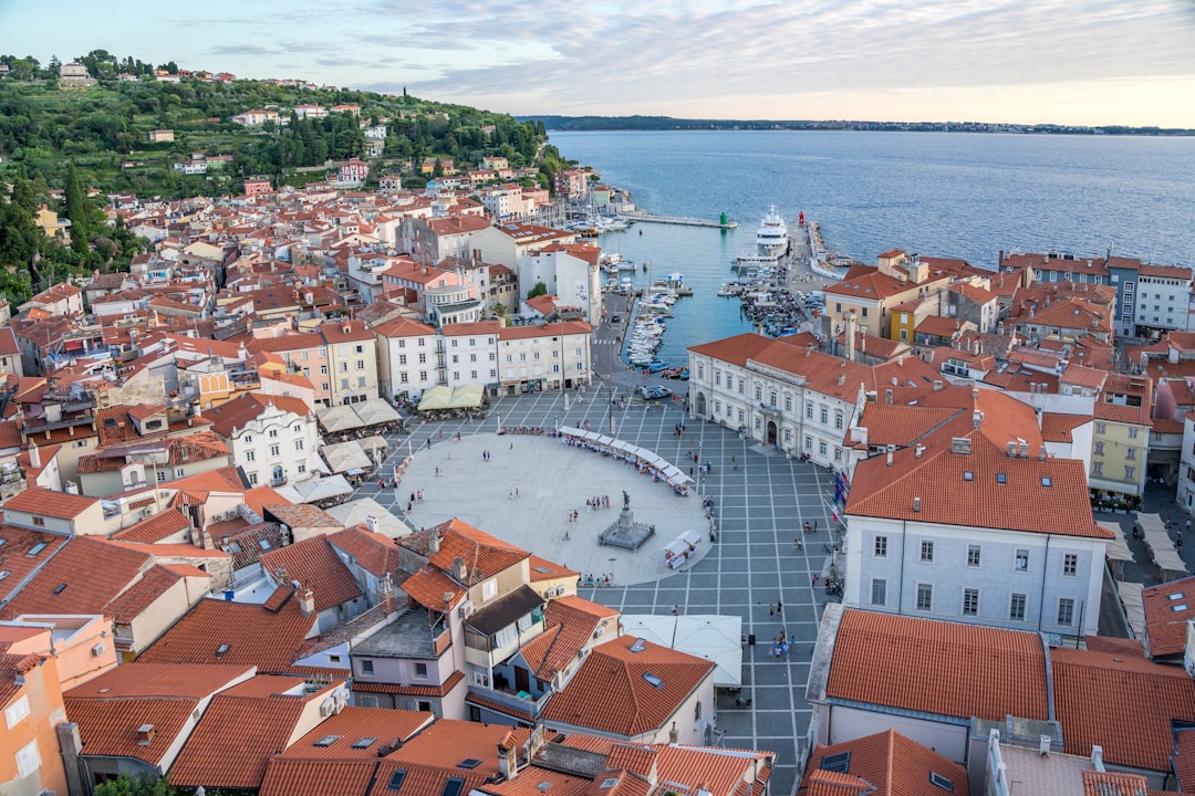 piran - an aerial view of a city next to a body of water